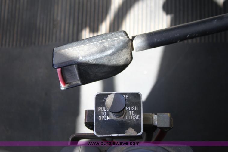 image for item A2893 1999 International 4900 tandem axle dump truck with plow and spreader