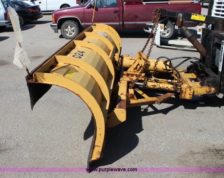 image for item A2893 1999 International 4900 tandem axle dump truck with plow and spreader