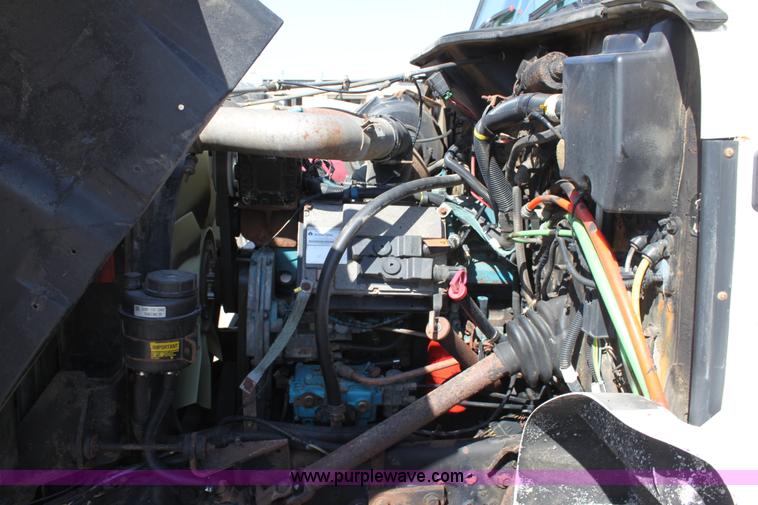 image for item A2893 1999 International 4900 tandem axle dump truck with plow and spreader