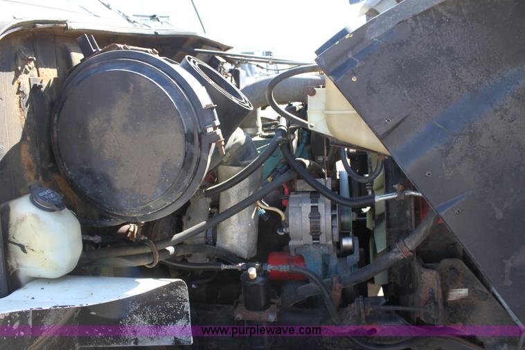 image for item A2893 1999 International 4900 tandem axle dump truck with plow and spreader