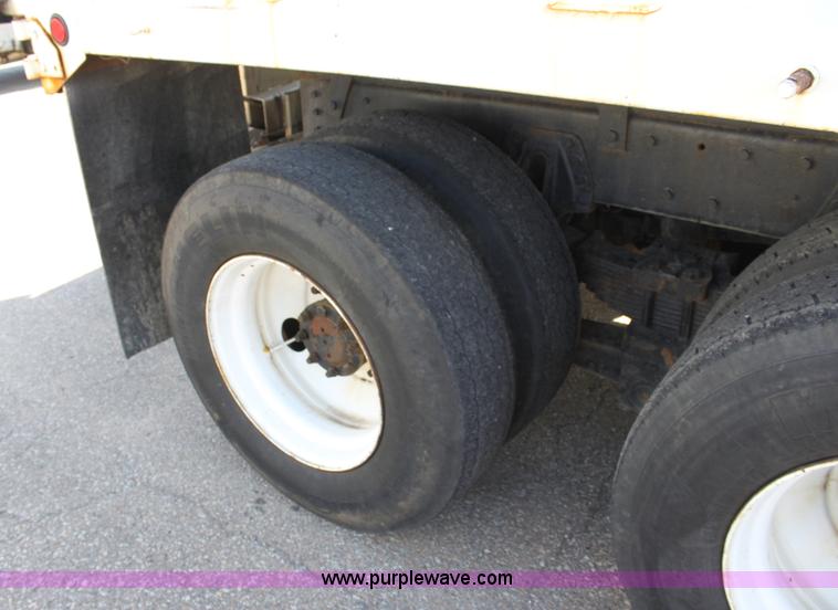 image for item A2893 1999 International 4900 tandem axle dump truck with plow and spreader