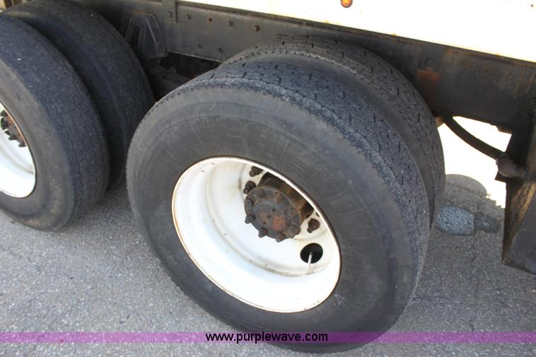 image for item A2893 1999 International 4900 tandem axle dump truck with plow and spreader