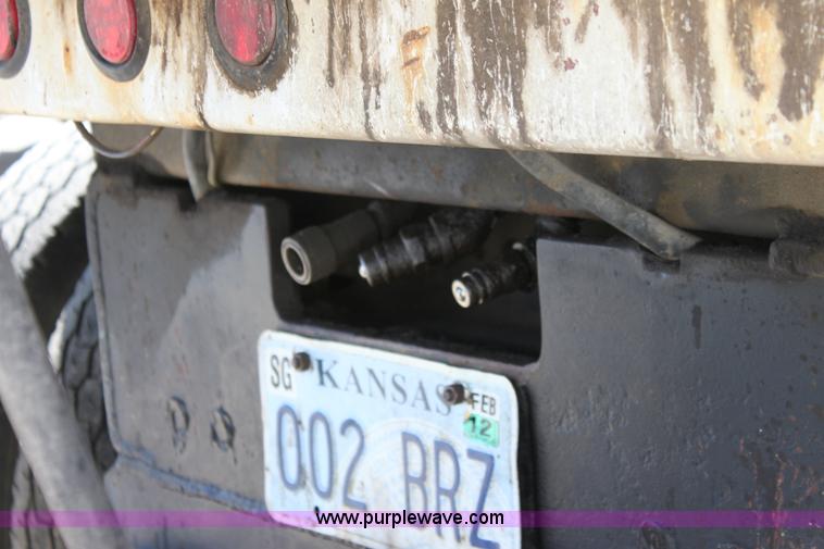 image for item A2893 1999 International 4900 tandem axle dump truck with plow and spreader