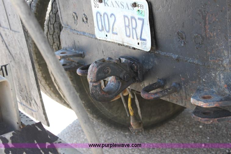 image for item A2893 1999 International 4900 tandem axle dump truck with plow and spreader