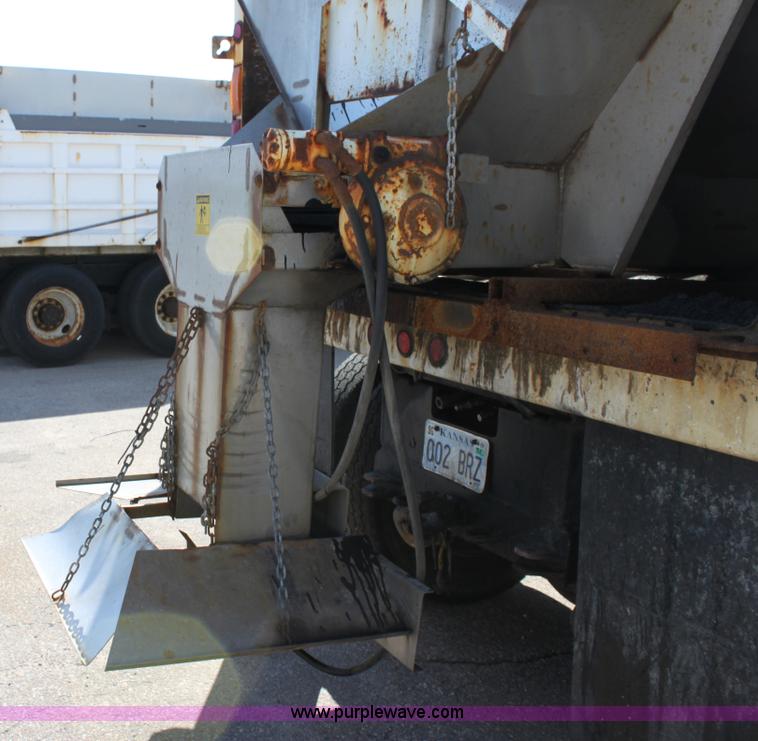 image for item A2893 1999 International 4900 tandem axle dump truck with plow and spreader