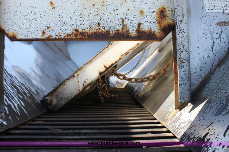 image for item A2893 1999 International 4900 tandem axle dump truck with plow and spreader