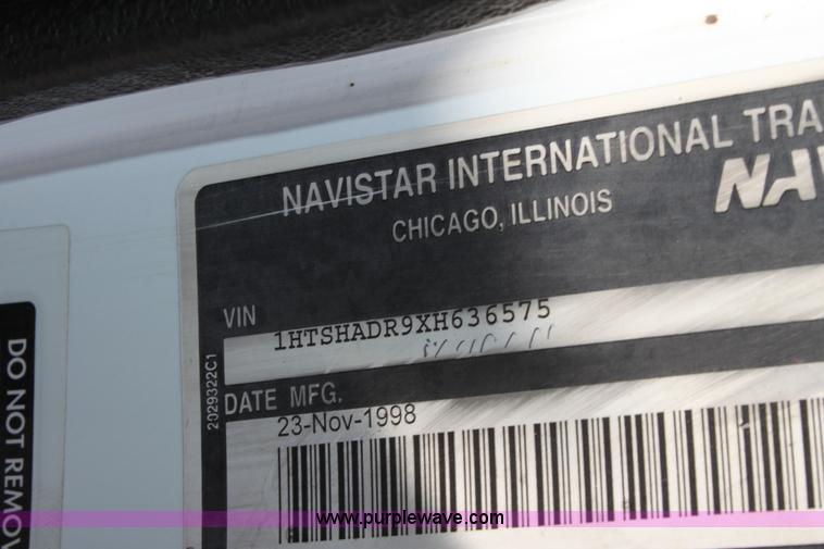 image for item A2893 1999 International 4900 tandem axle dump truck with plow and spreader