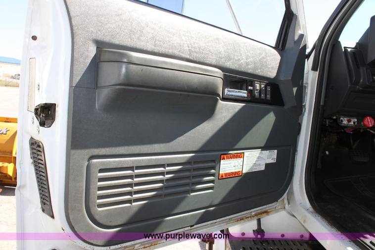 image for item A2914 1996 GMC TopKick tandem axle dump truck with plow and spreader