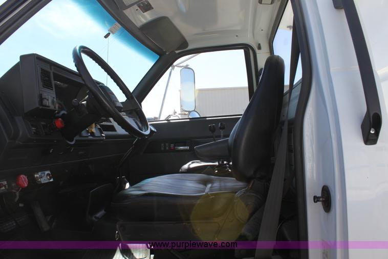 image for item A2914 1996 GMC TopKick tandem axle dump truck with plow and spreader