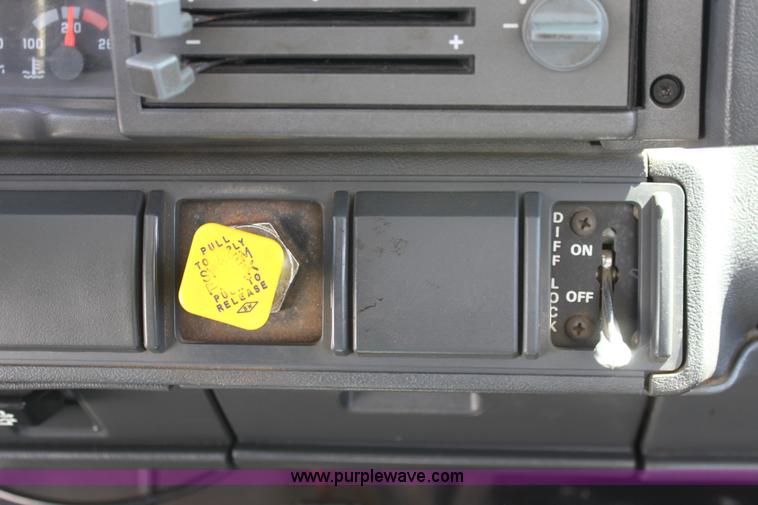 image for item A2914 1996 GMC TopKick tandem axle dump truck with plow and spreader