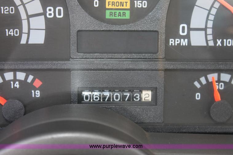 image for item A2914 1996 GMC TopKick tandem axle dump truck with plow and spreader