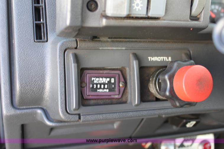 image for item A2914 1996 GMC TopKick tandem axle dump truck with plow and spreader