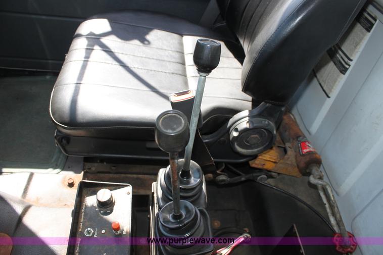 image for item A2914 1996 GMC TopKick tandem axle dump truck with plow and spreader