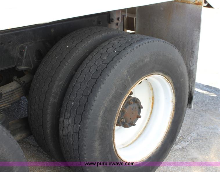 image for item A2914 1996 GMC TopKick tandem axle dump truck with plow and spreader