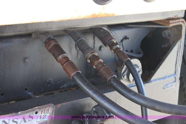 image for item A2914 1996 GMC TopKick tandem axle dump truck with plow and spreader