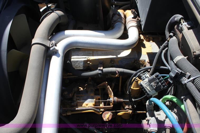 image for item A2914 1996 GMC TopKick tandem axle dump truck with plow and spreader