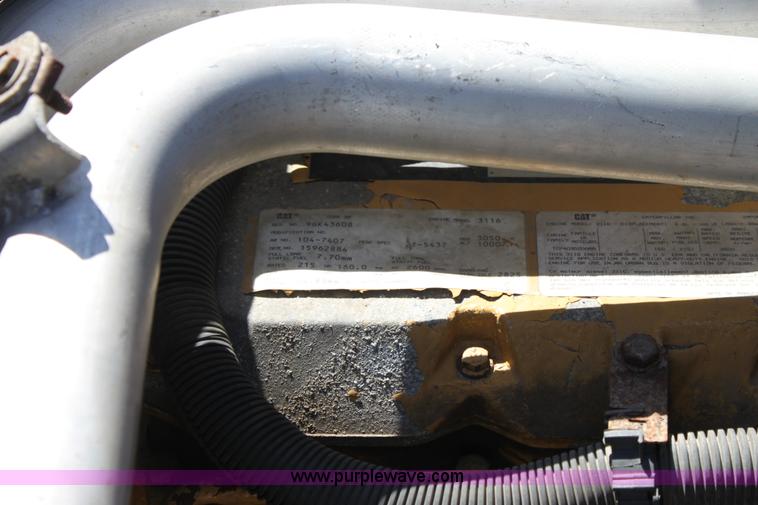 image for item A2914 1996 GMC TopKick tandem axle dump truck with plow and spreader