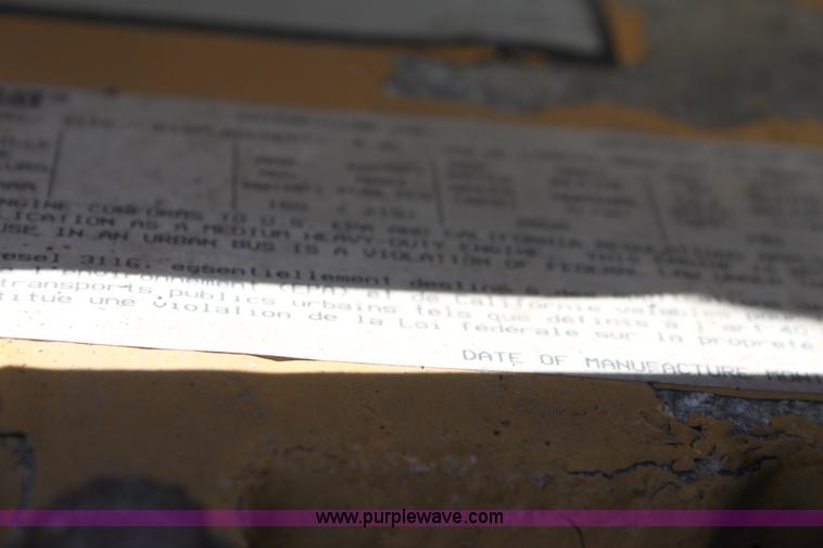 image for item A2914 1996 GMC TopKick tandem axle dump truck with plow and spreader