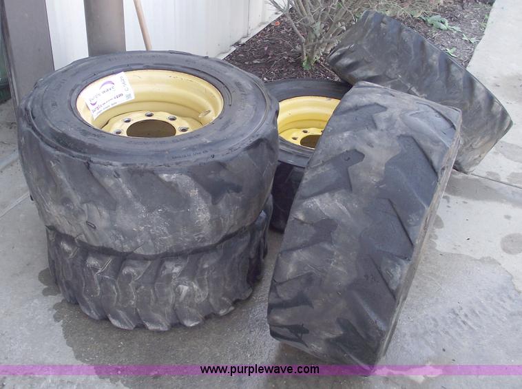 image for item C5628 (5) skid steer wheels and tires