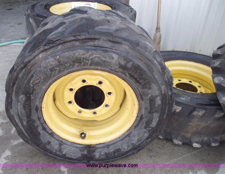 image for item C5628 (5) skid steer wheels and tires