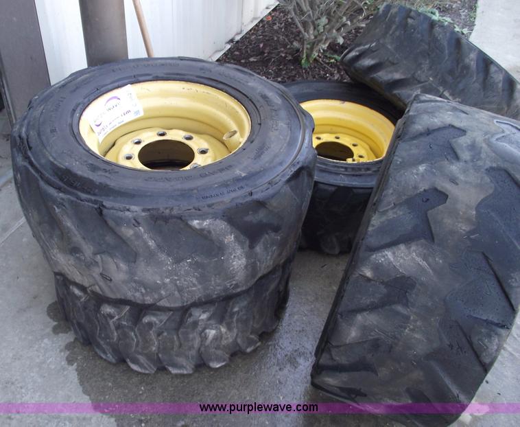 image for item C5628 (5) skid steer wheels and tires