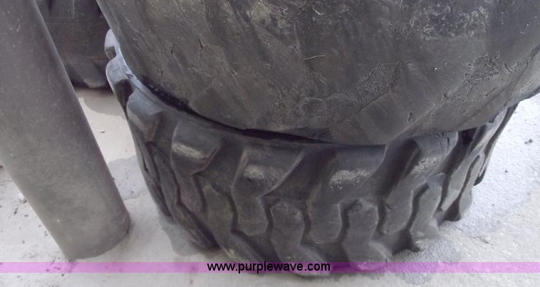 image for item C5628 (5) skid steer wheels and tires