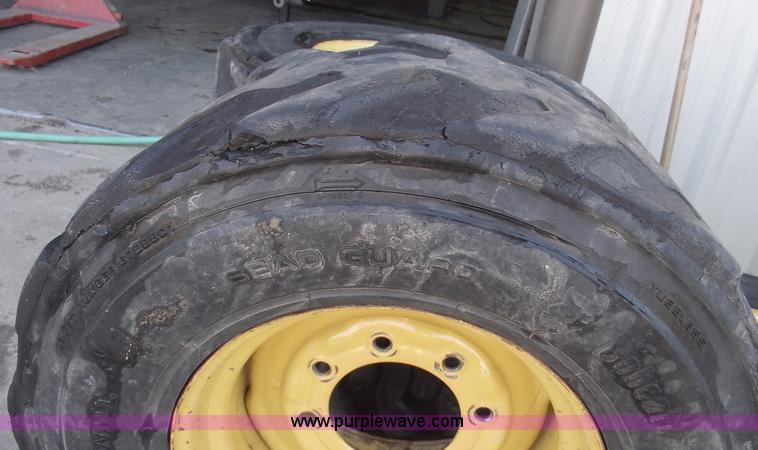image for item C5628 (5) skid steer wheels and tires