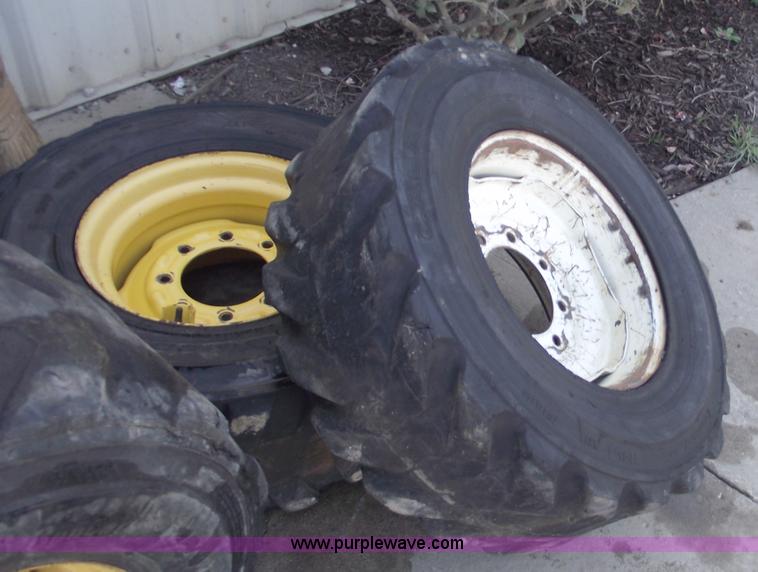 image for item C5628 (5) skid steer wheels and tires