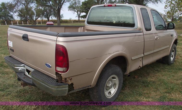 image for item C5673 1997 Ford F150 XLT super cab pickup truck