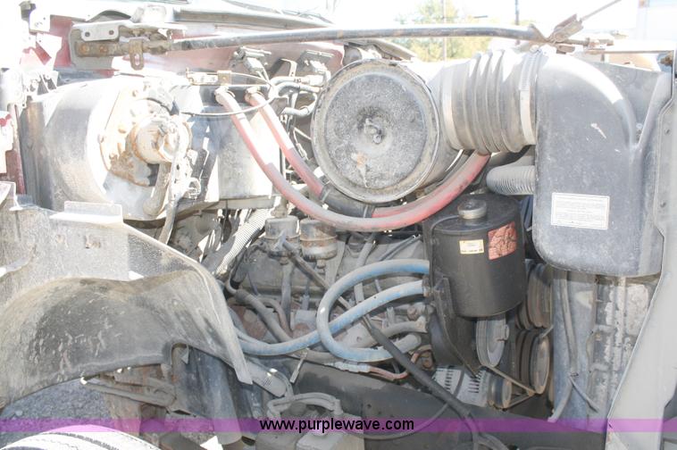 image for item A3191 1995 Ford F700 flatbed dump truck