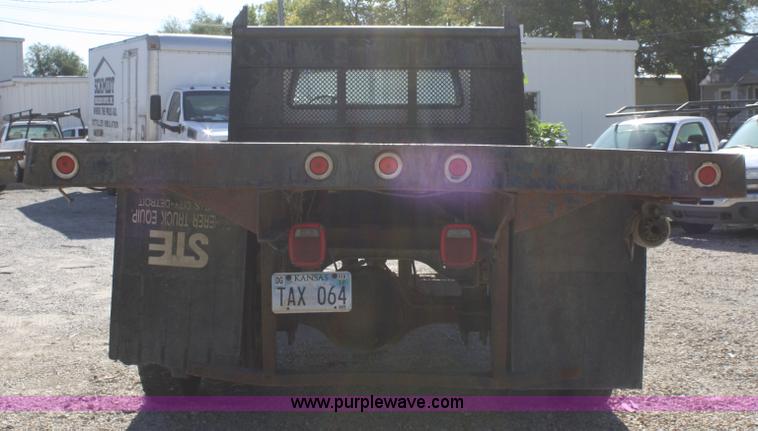 image for item A3216 1996 Ford F700 flatbed truck