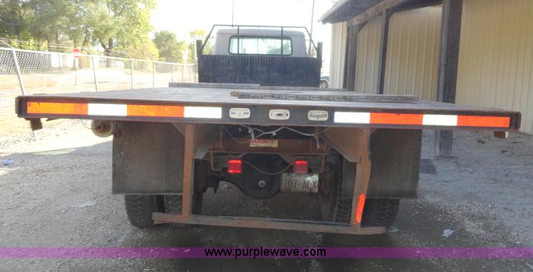 image for item A3226 1999 International 4700 flatbed truck