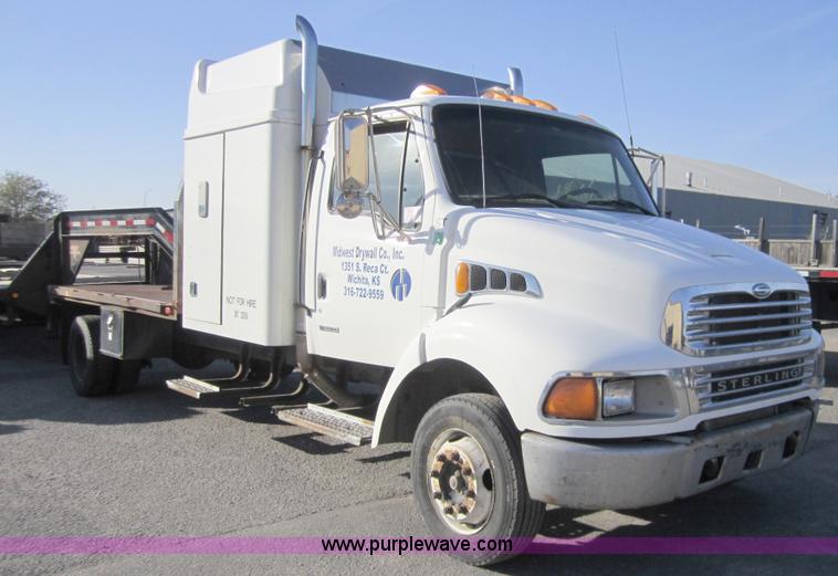 image for item A4414 2001 Sterling M6500 Acterra flatbed semi truck