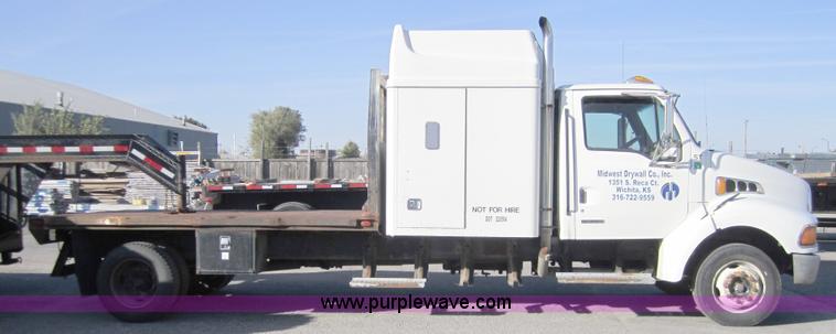 image for item A4414 2001 Sterling M6500 Acterra flatbed semi truck
