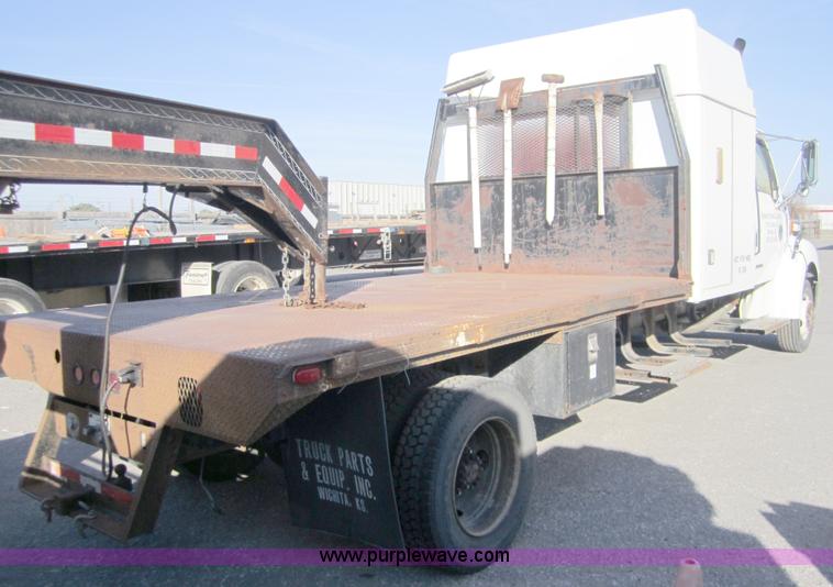 image for item A4414 2001 Sterling M6500 Acterra flatbed semi truck