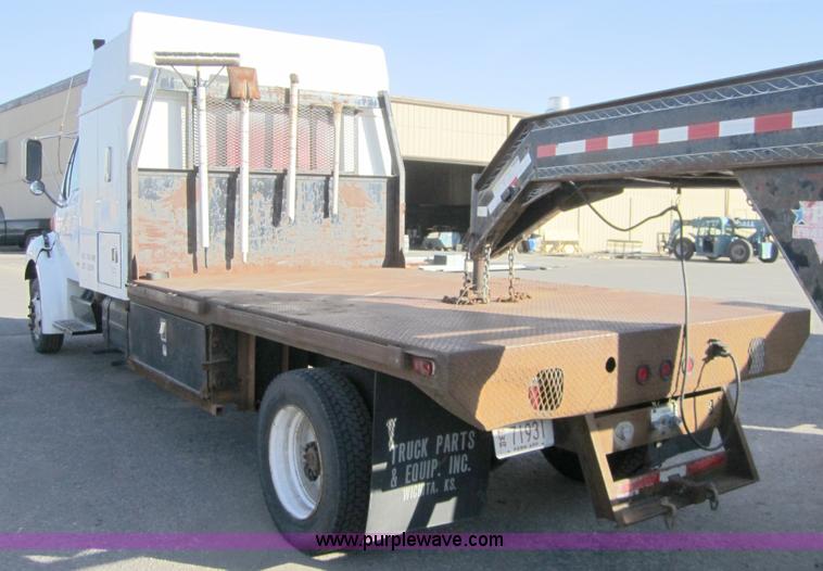image for item A4414 2001 Sterling M6500 Acterra flatbed semi truck