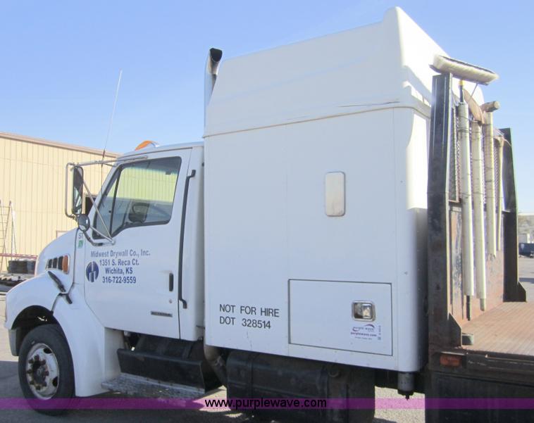 image for item A4414 2001 Sterling M6500 Acterra flatbed semi truck