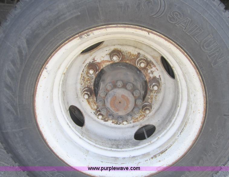 image for item A4414 2001 Sterling M6500 Acterra flatbed semi truck