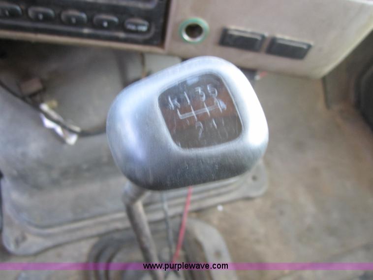 image for item A4414 2001 Sterling M6500 Acterra flatbed semi truck