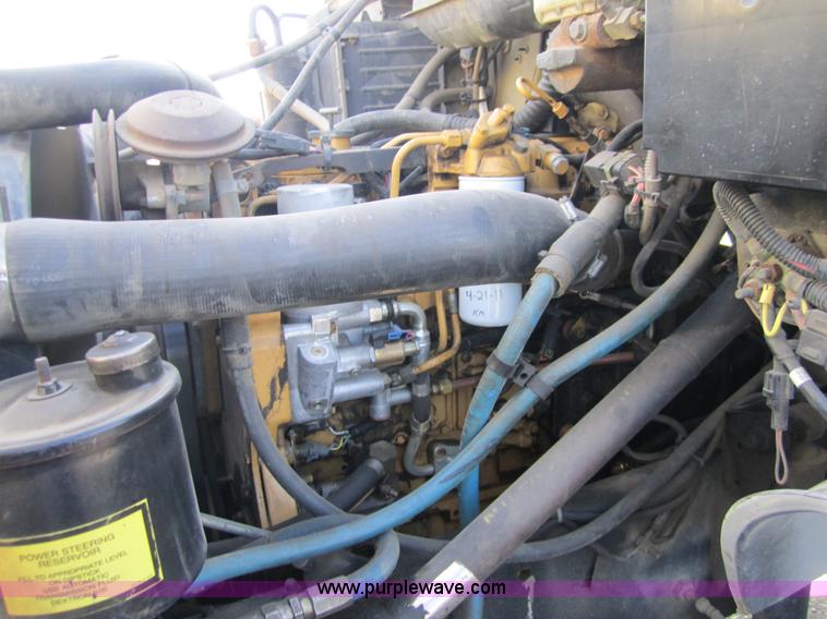 image for item A4414 2001 Sterling M6500 Acterra flatbed semi truck