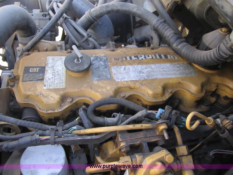 image for item A4414 2001 Sterling M6500 Acterra flatbed semi truck