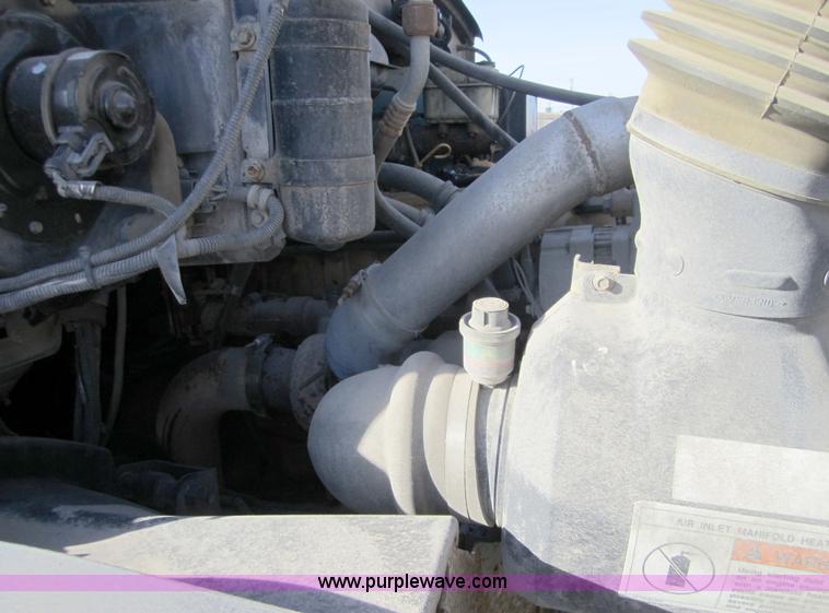 image for item A4414 2001 Sterling M6500 Acterra flatbed semi truck