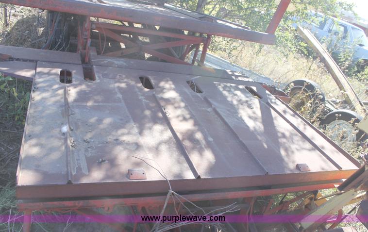 image for item B8521 New Holland 1010 small square bale stack wagon
