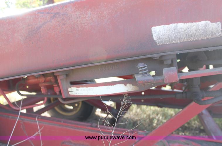 image for item B8521 New Holland 1010 small square bale stack wagon