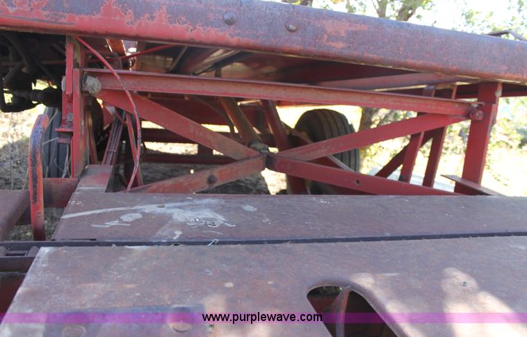 image for item B8521 New Holland 1010 small square bale stack wagon