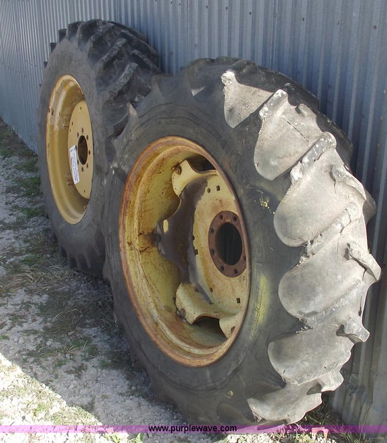 image for item C5689 (2) 13.6-28 tractor tires and wheels