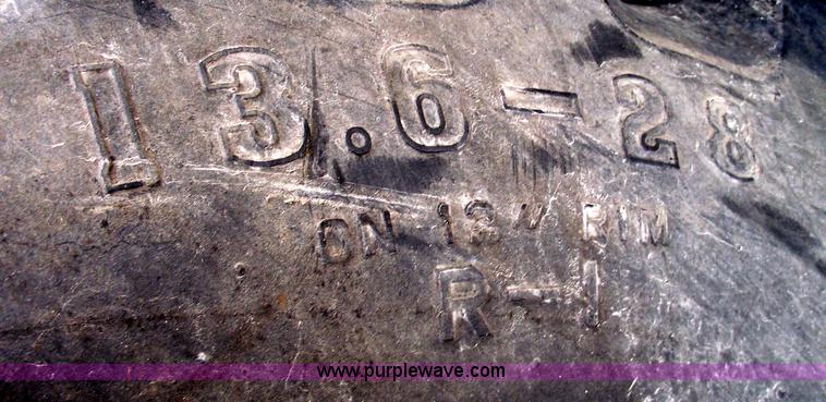 image for item C5689 (2) 13.6-28 tractor tires and wheels