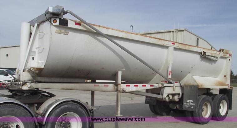 image for item C5704 1999 Clement 26' barrel end dump trailer