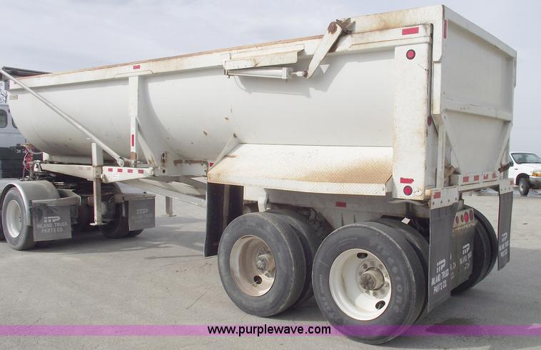 image for item C5704 1999 Clement 26' barrel end dump trailer