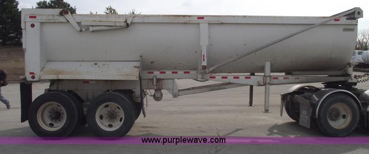 image for item C5704 1999 Clement 26' barrel end dump trailer